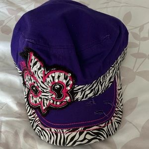 L.O.G.A women’s purple fleur d’ Le Zebra logo hat. Embellished with crystals.